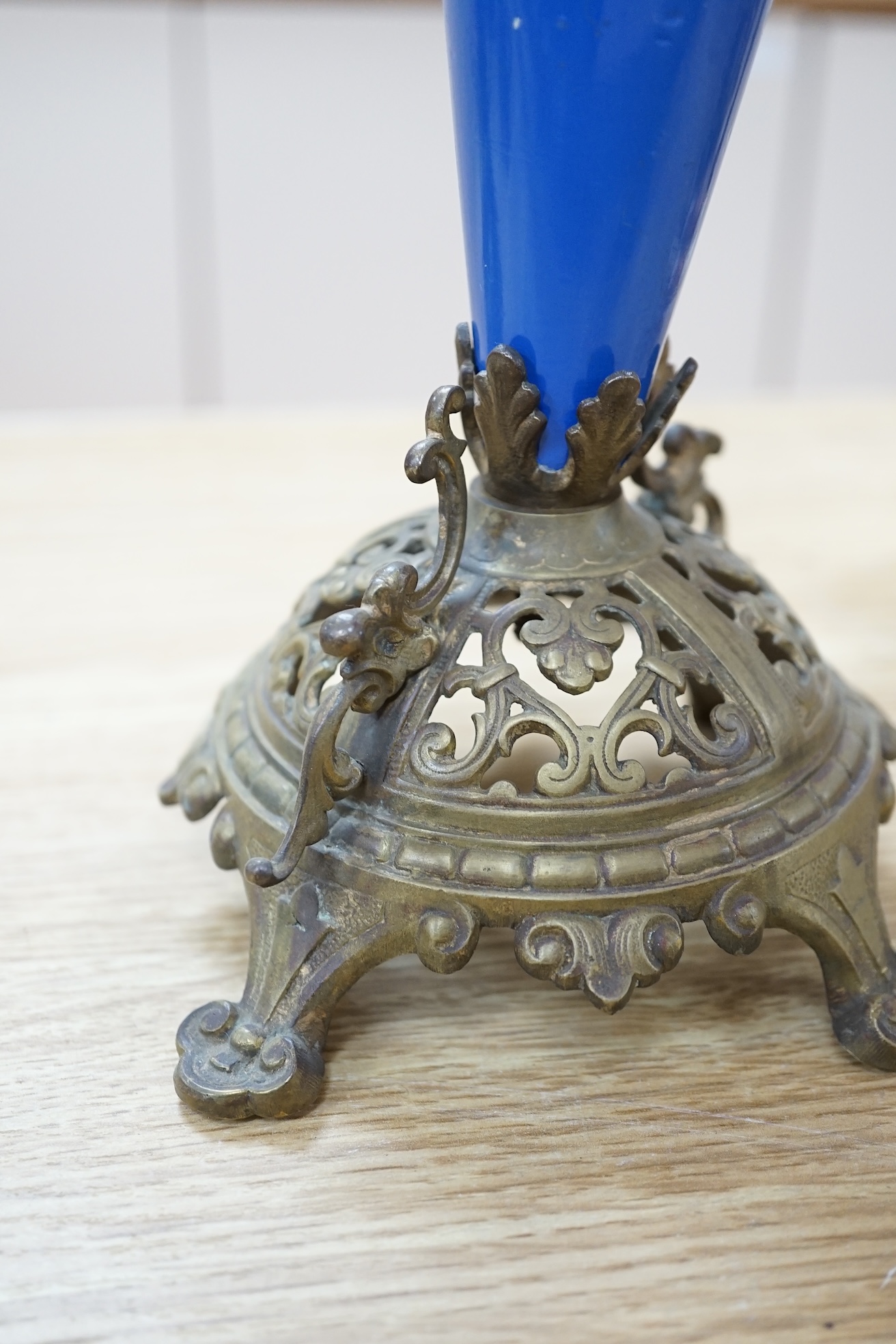 A pair of French blue enamelled ornate brass two branch candlesticks, 42cm high. Condition - one finial missing, scratches to enamel